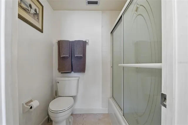 a living room with furniture rug and a window