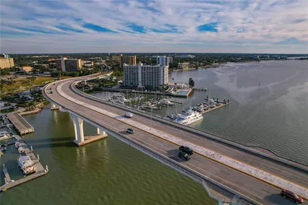 a view of a swimming pool with outdoor seating