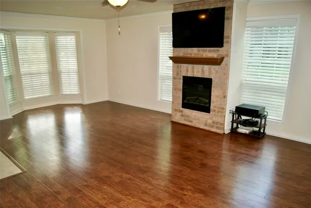 a view of fireplace and window in a room