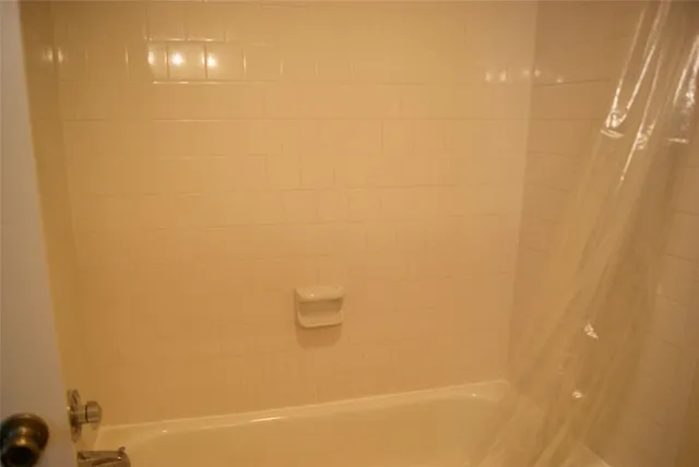 a view of a patio with table and chairs next to a yard