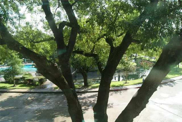 a view of a house with backyard porch and sitting area