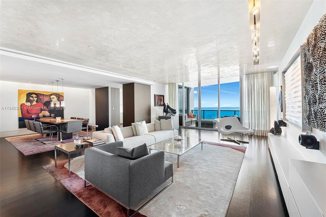 a view of a balcony with table and chairs