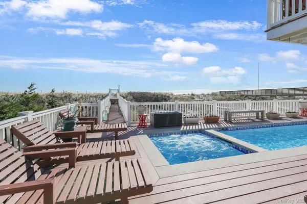 a view of a balcony with wooden floor