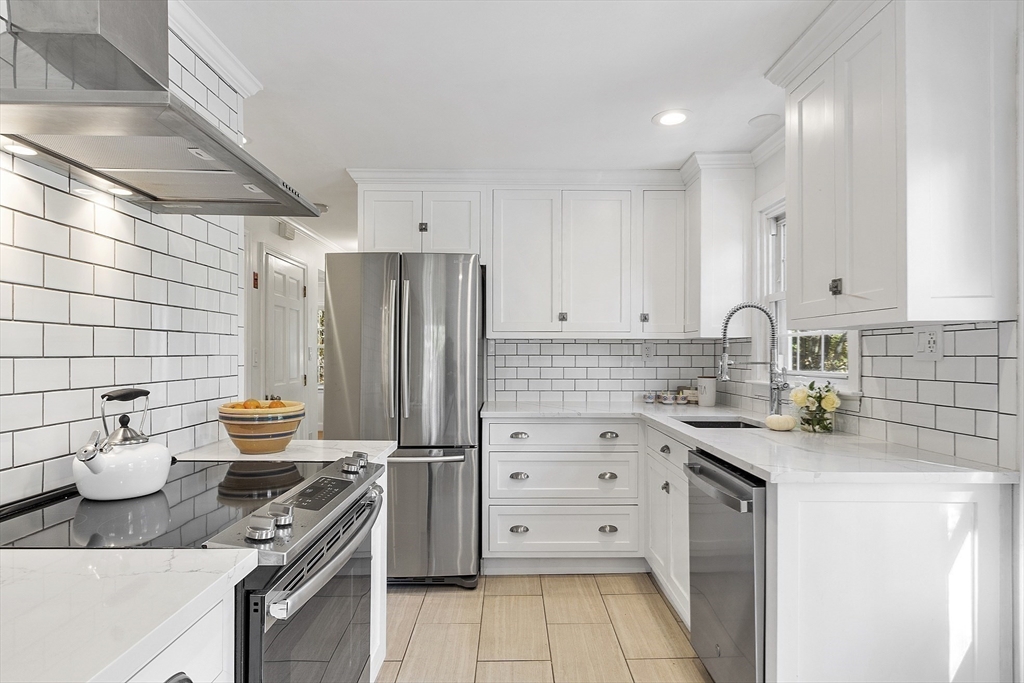 6 Gray Road Andover, MA 01810 - Photo 11 of 36 a kitchen with a sink cabinets and appliances