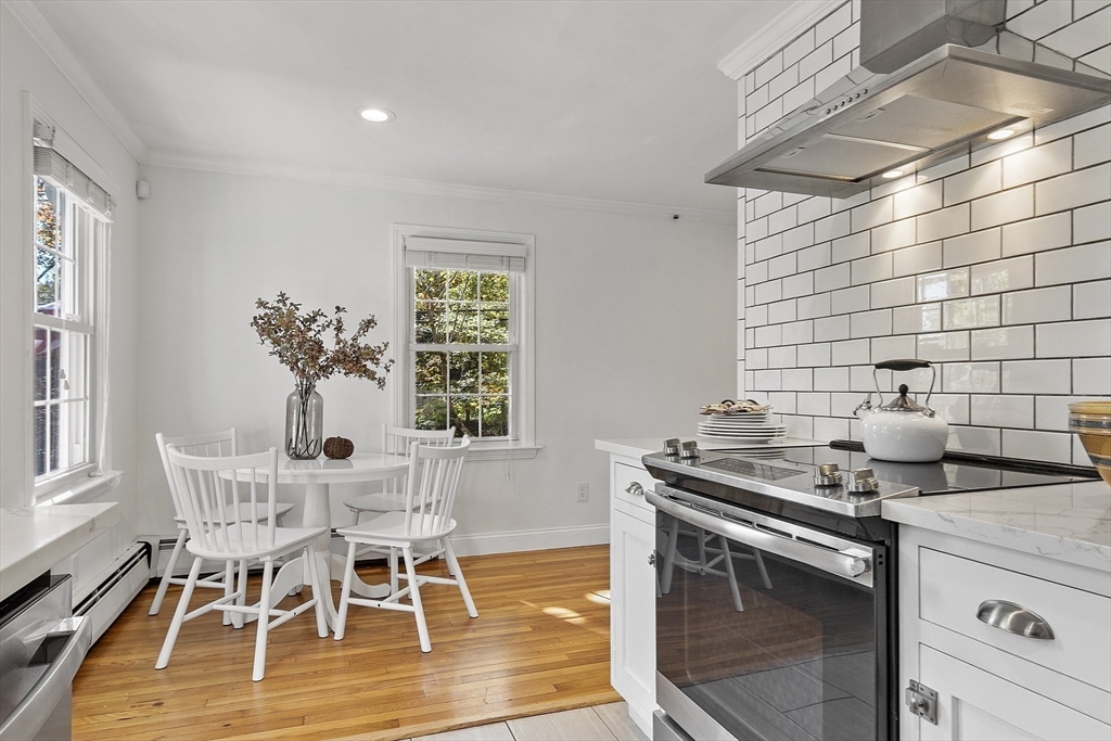 6 Gray Road Andover, MA 01810 - Photo 12 of 36 a dining room with a sink and chairs