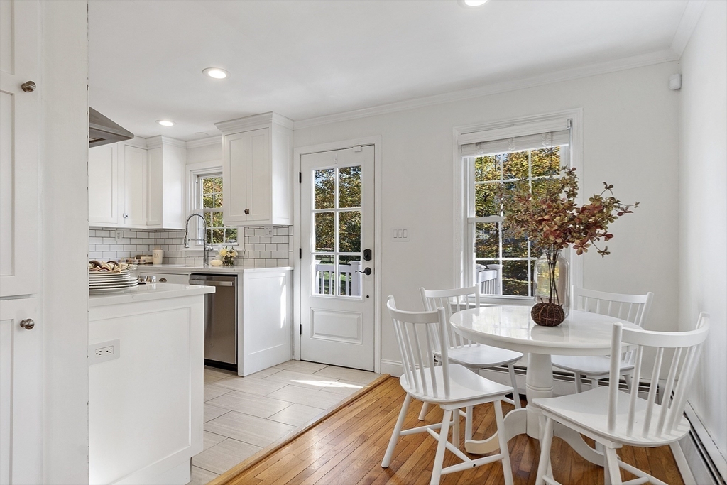 6 Gray Road Andover, MA 01810 - Photo 13 of 36 a kitchen with white cabinets and stainless steel appliances