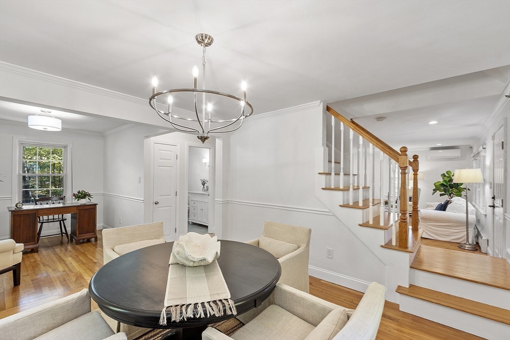 6 Gray Road Andover, MA 01810 - Photo 22 of 36 a living room with furniture a chandelier and a table