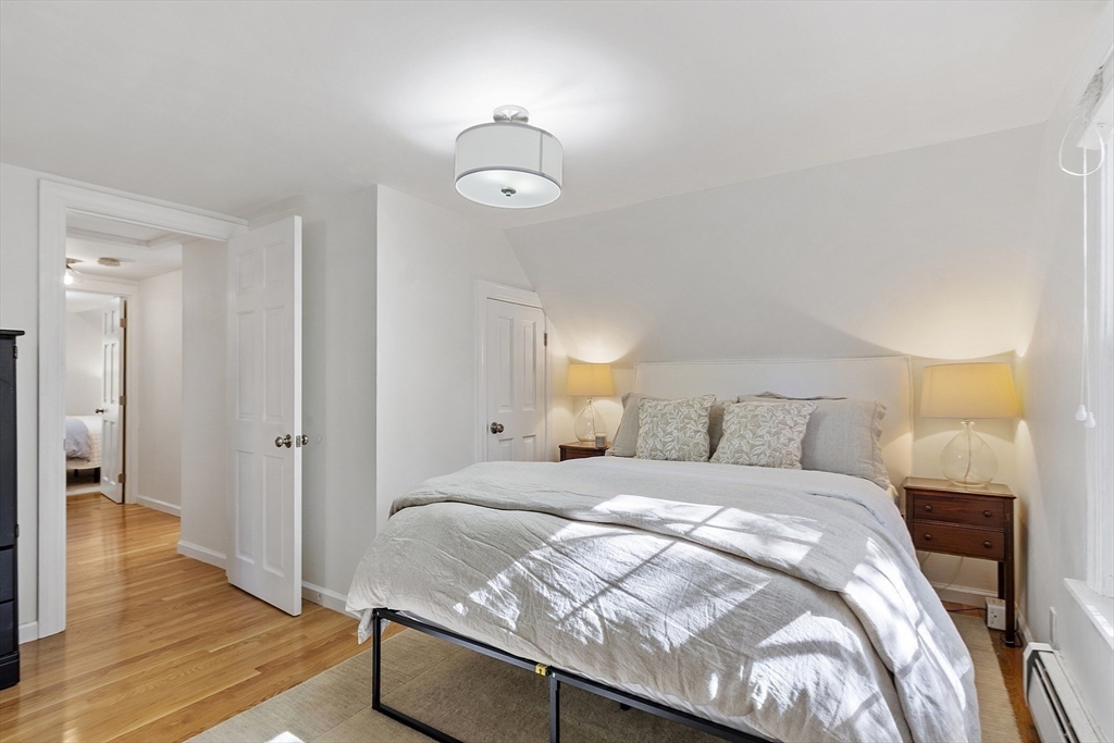 6 Gray Road Andover, MA 01810 - Photo 27 of 36 a bedroom with a bed and wooden floor