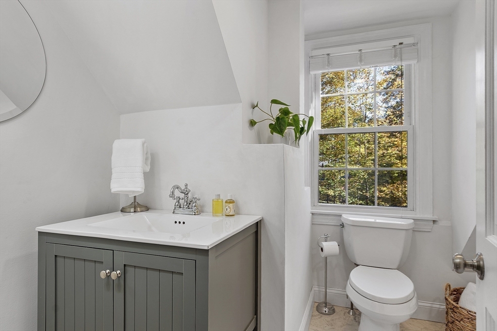 6 Gray Road Andover, MA 01810 - Photo 30 of 36 a bathroom with a sink a toilet and a window