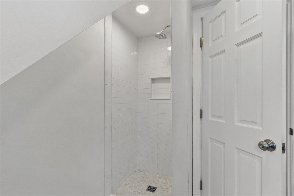 6 Gray Road Andover, MA 01810 - Photo 31 of 36 a bathroom with a glass shower door