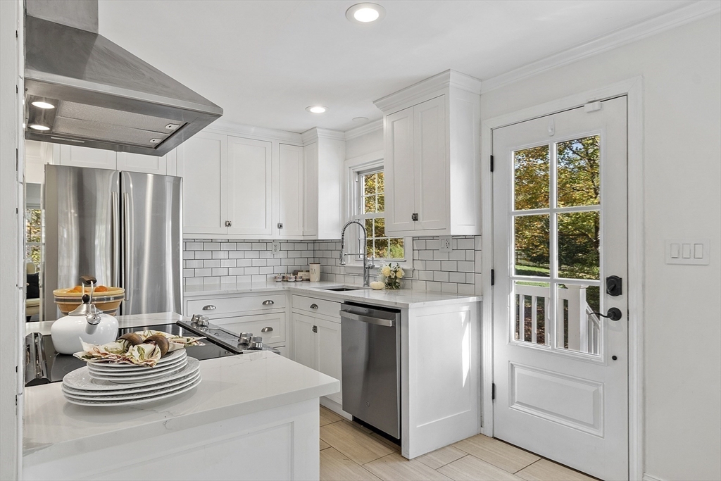6 Gray Road Andover, MA 01810 - Photo 10 of 36 a kitchen with a sink stove and cabinets