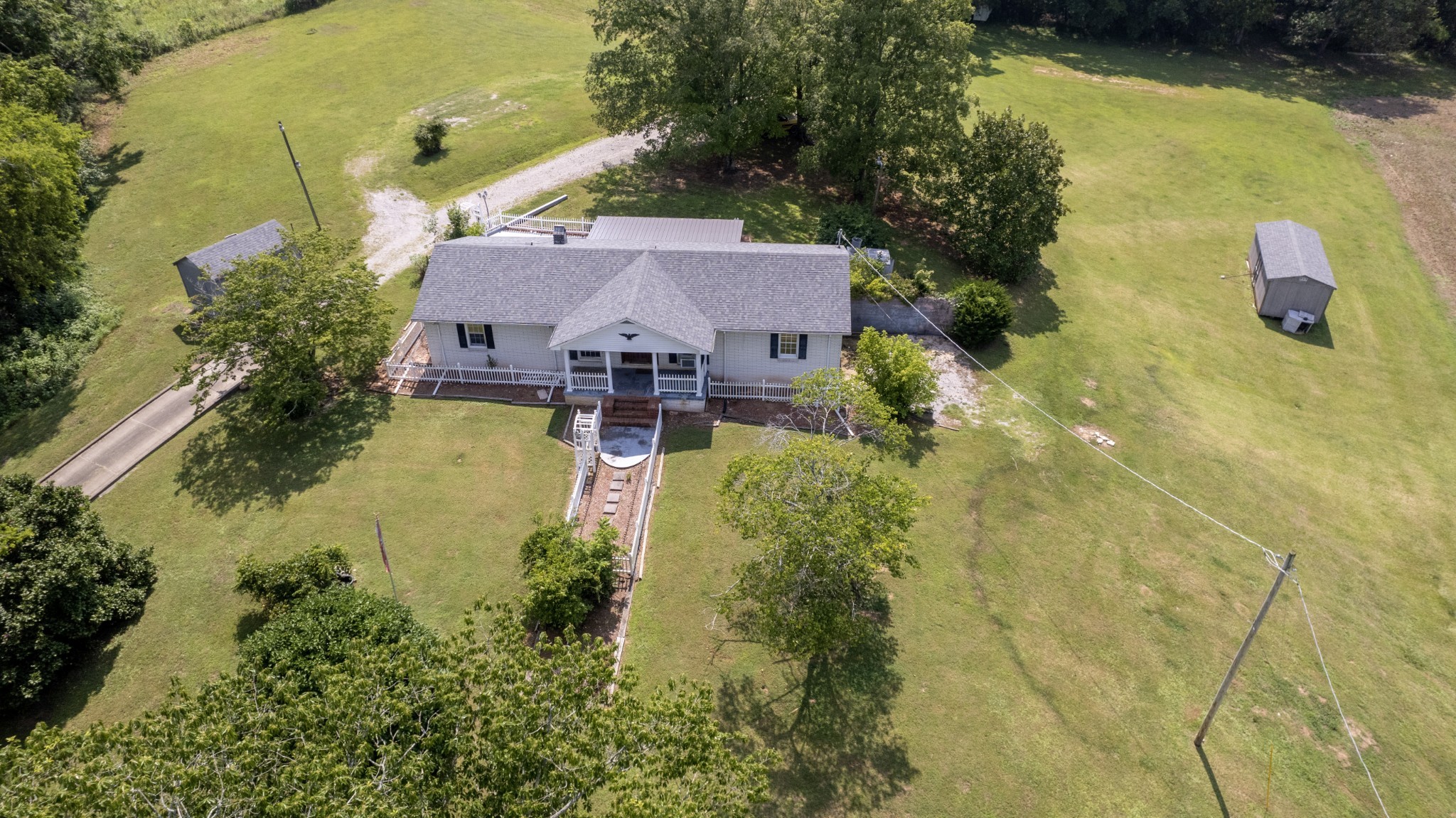 500 Shuler Branch Road Ethridge, TN 38456 - Photo 14 of 27 an aerial view of a house with swimming pool and large trees