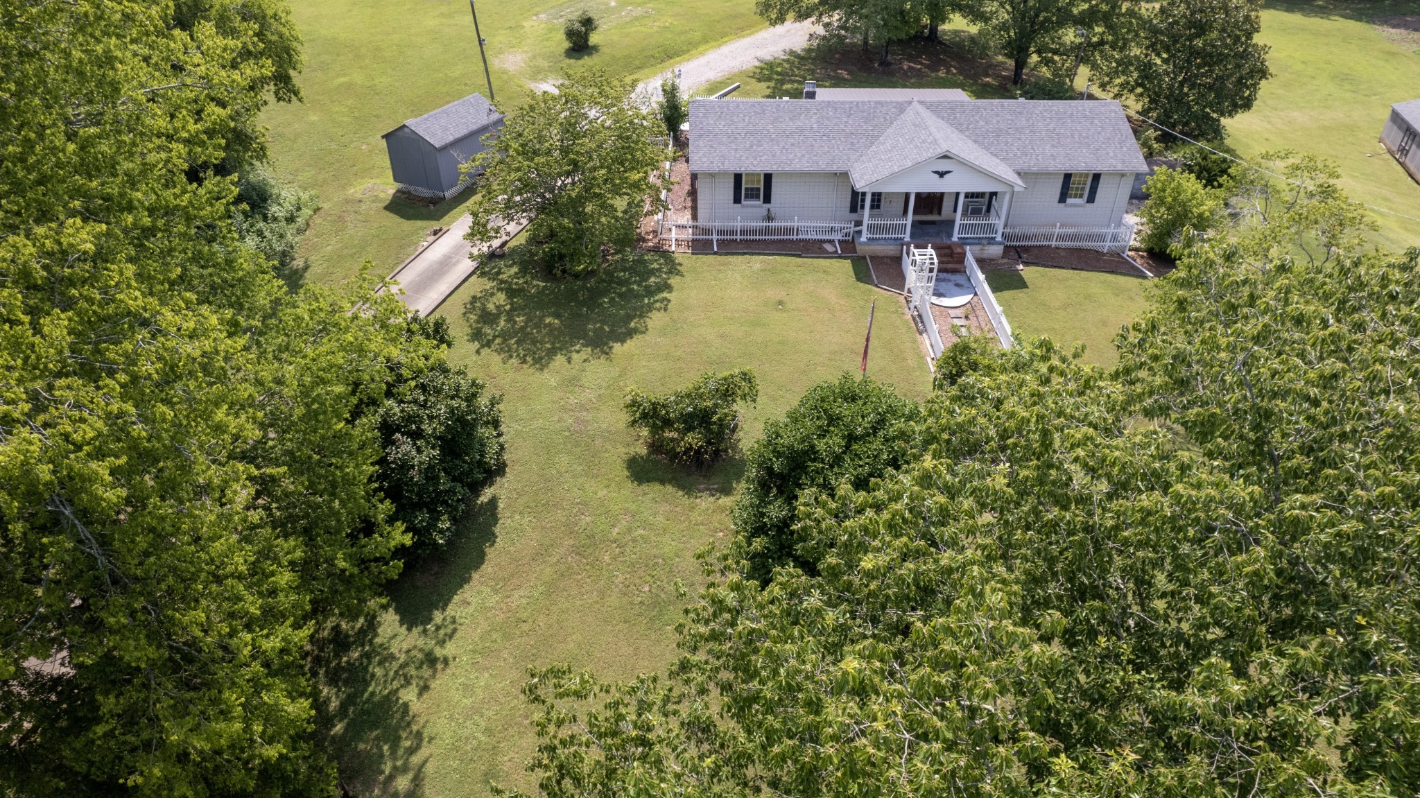 500 Shuler Branch Road Ethridge, TN 38456 - Photo 15 of 27 an aerial view of a house with swimming pool and large trees