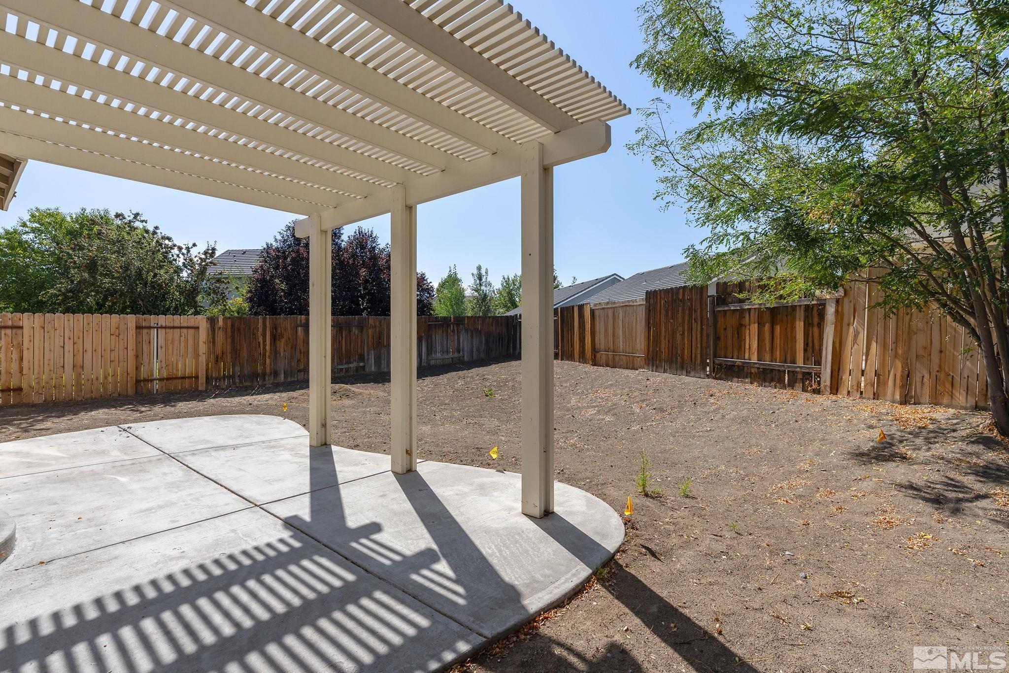 9671 Comanche Moon Drive Reno, NV 89521 - Photo 16 of 18 a view of a house with a backyard