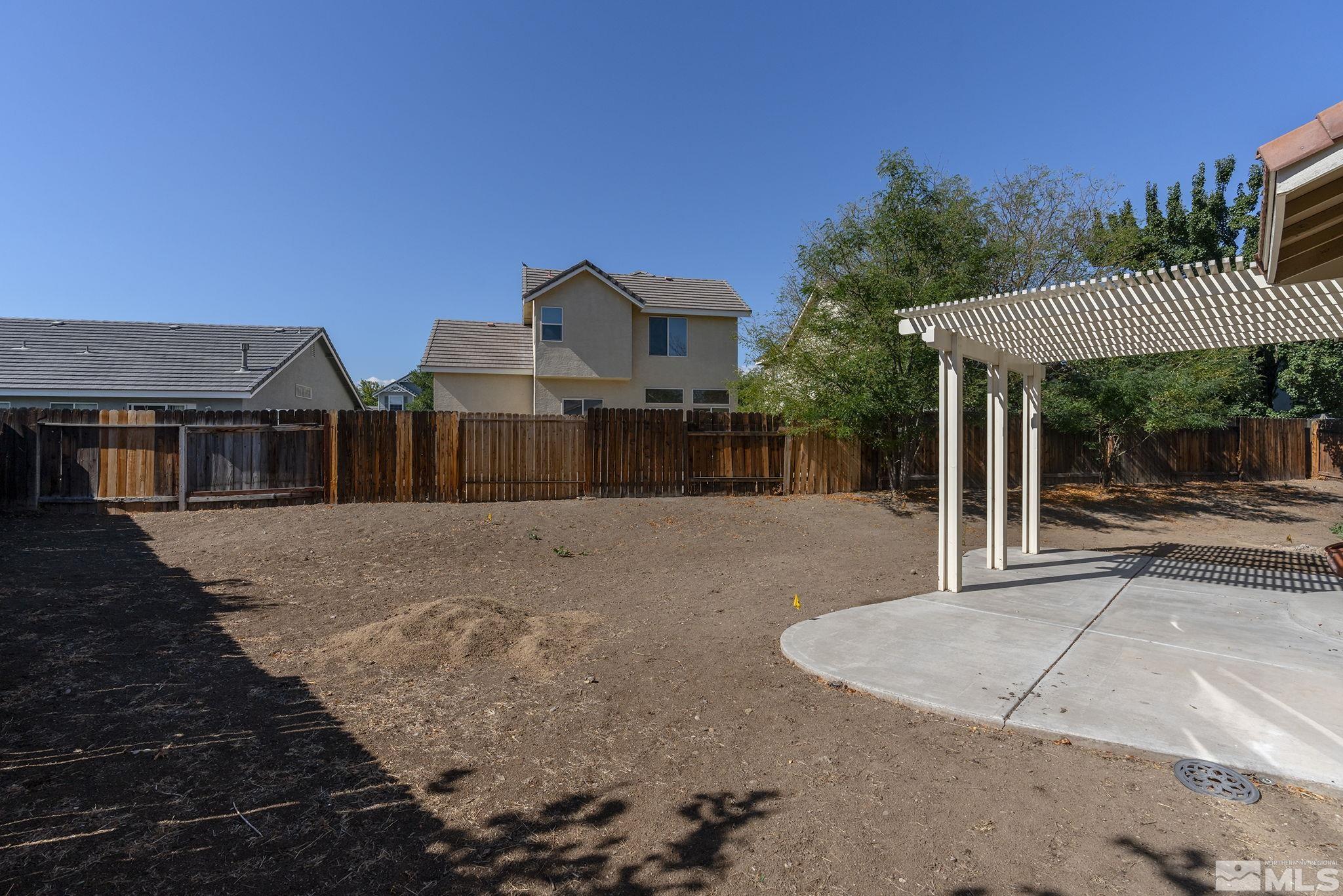 9671 Comanche Moon Drive Reno, NV 89521 - Photo 17 of 18 a view of a house with a yard