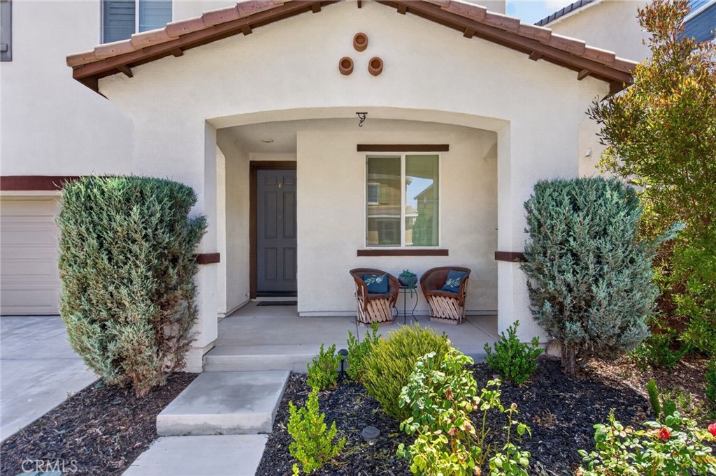 19435 Fortunello Avenue Riverside, CA 92508 - Photo 4 of 51 a front view of a house with garden