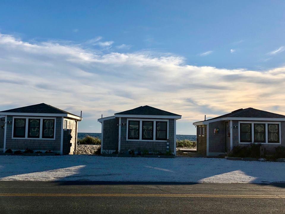 503 Shore Road, Unit 26 Truro, MA 02666 - Photo 2 of 17 a front view of a house with a garden
