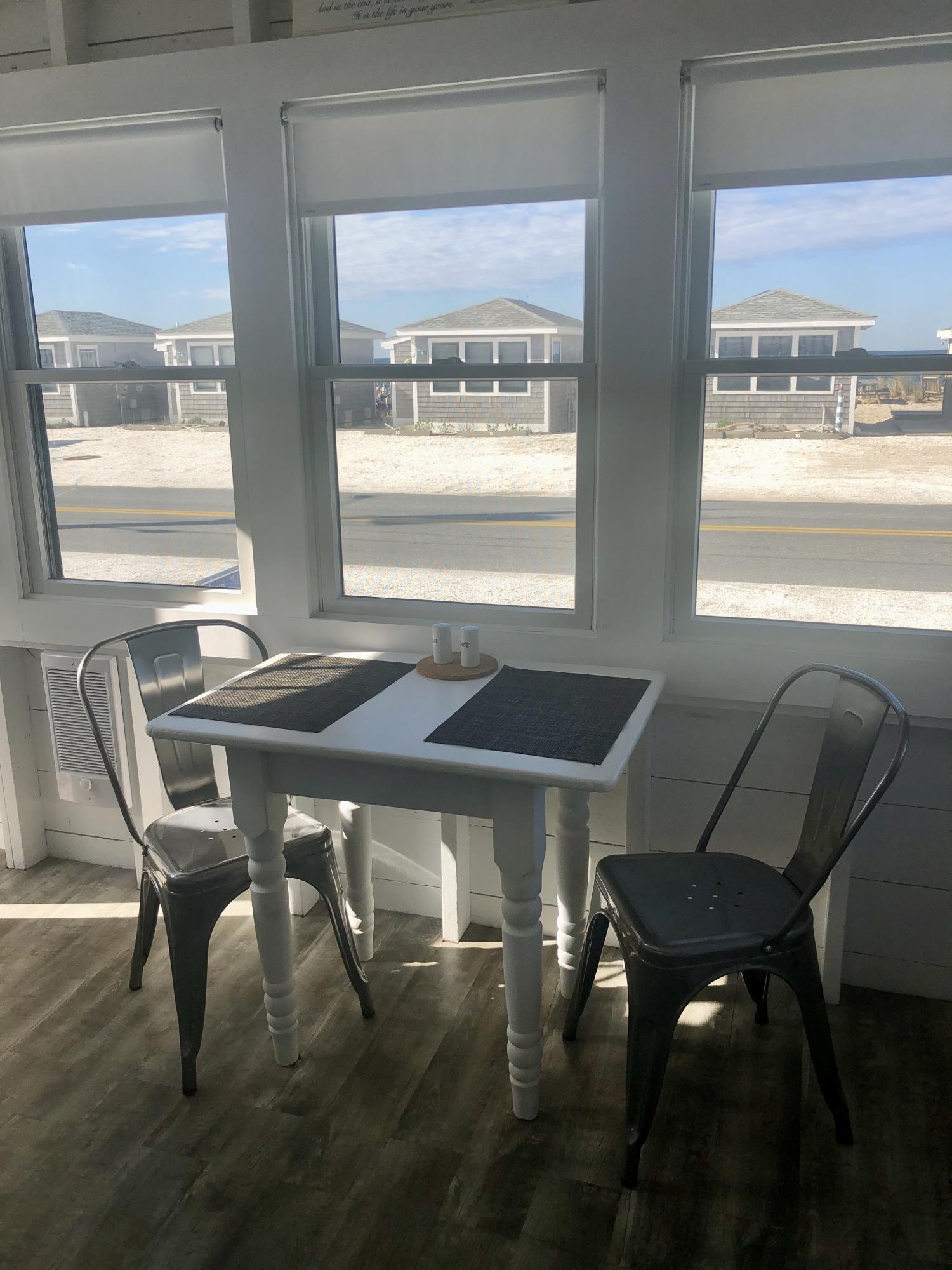 503 Shore Road, Unit 26 Truro, MA 02666 - Photo 3 of 17 a view of a dining room with furniture and a window