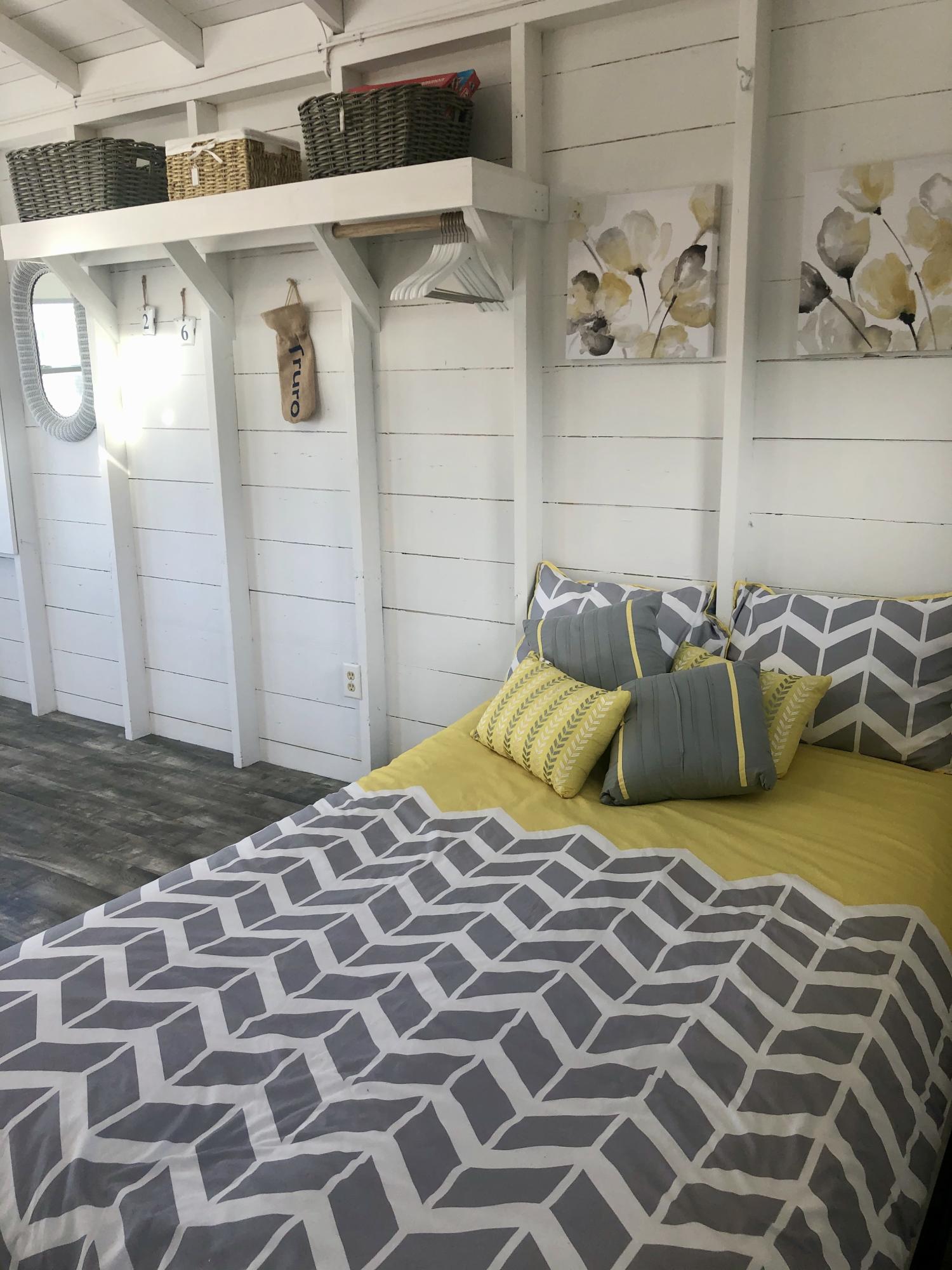 503 Shore Road, Unit 26 Truro, MA 02666 - Photo 7 of 17 a bedroom with a bed and painting on the wall