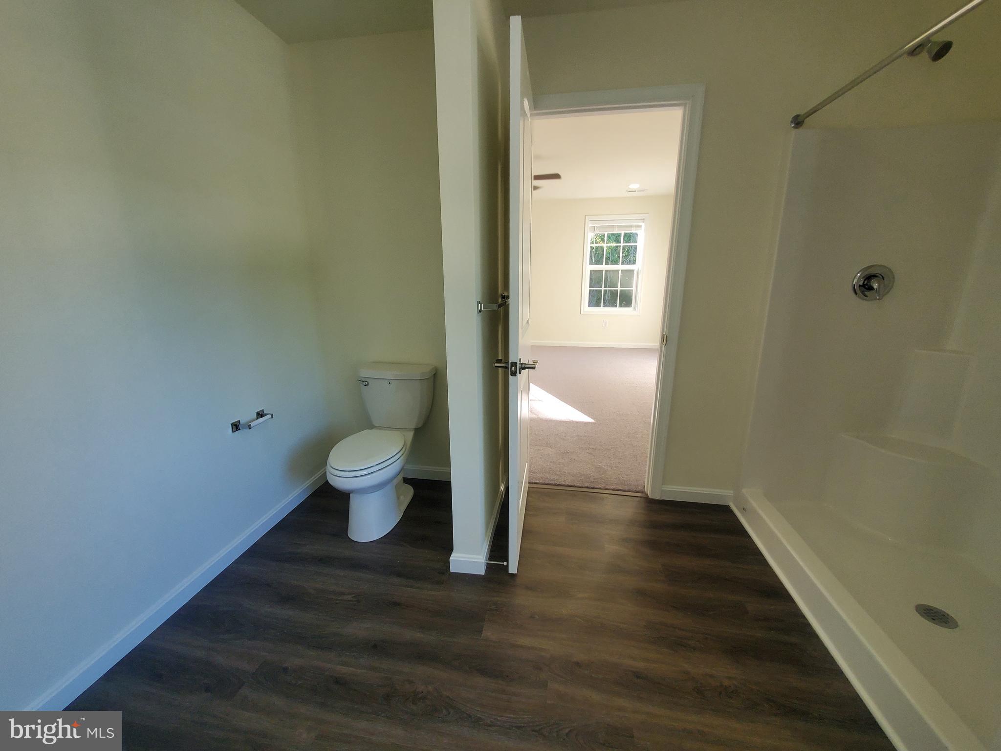 205 Cilento Drive Magnolia, DE 19962 - Photo 17 of 46 a bathroom with a toilet and a view