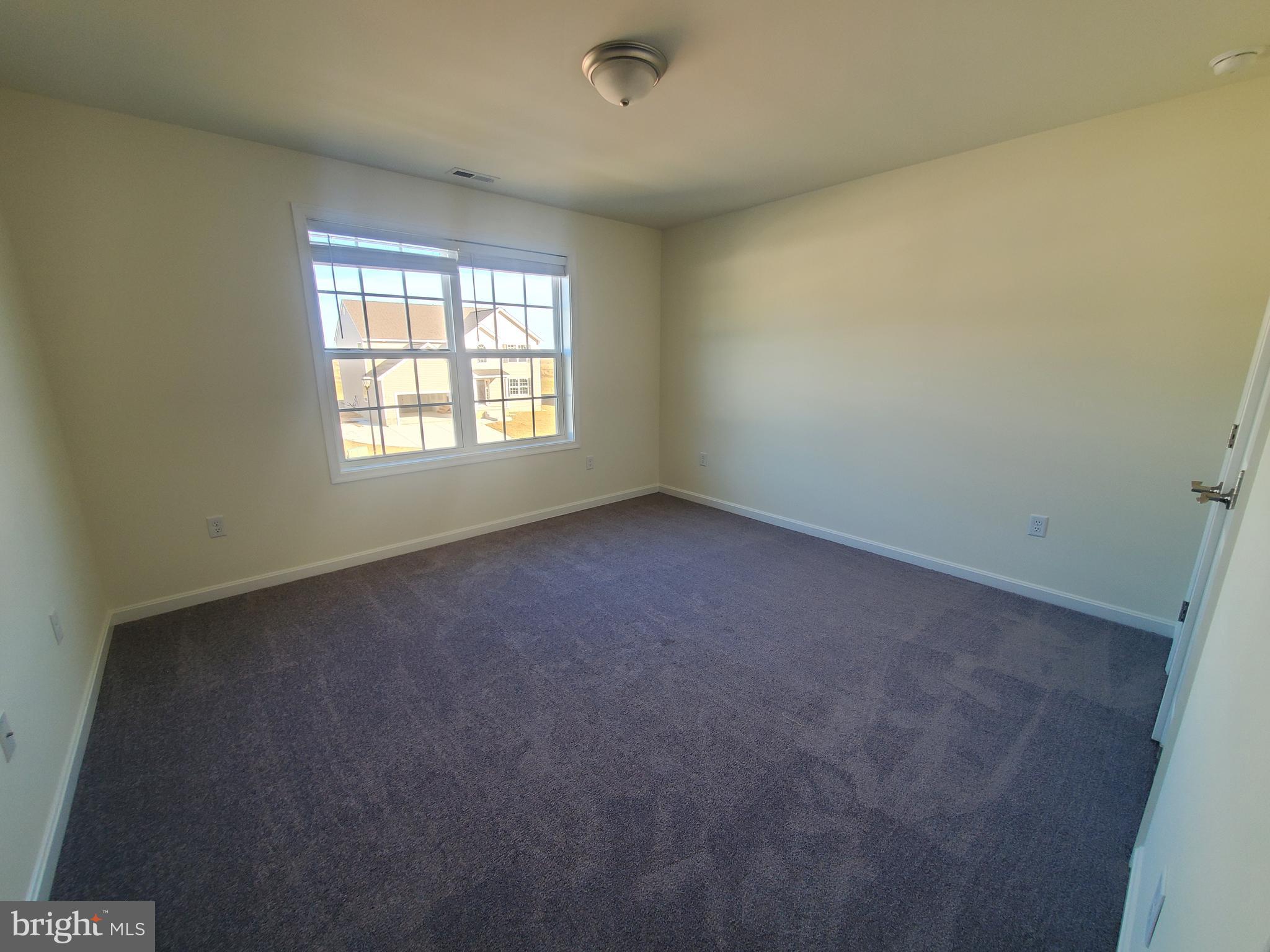 205 Cilento Drive Magnolia, DE 19962 - Photo 32 of 46 an empty room with a window