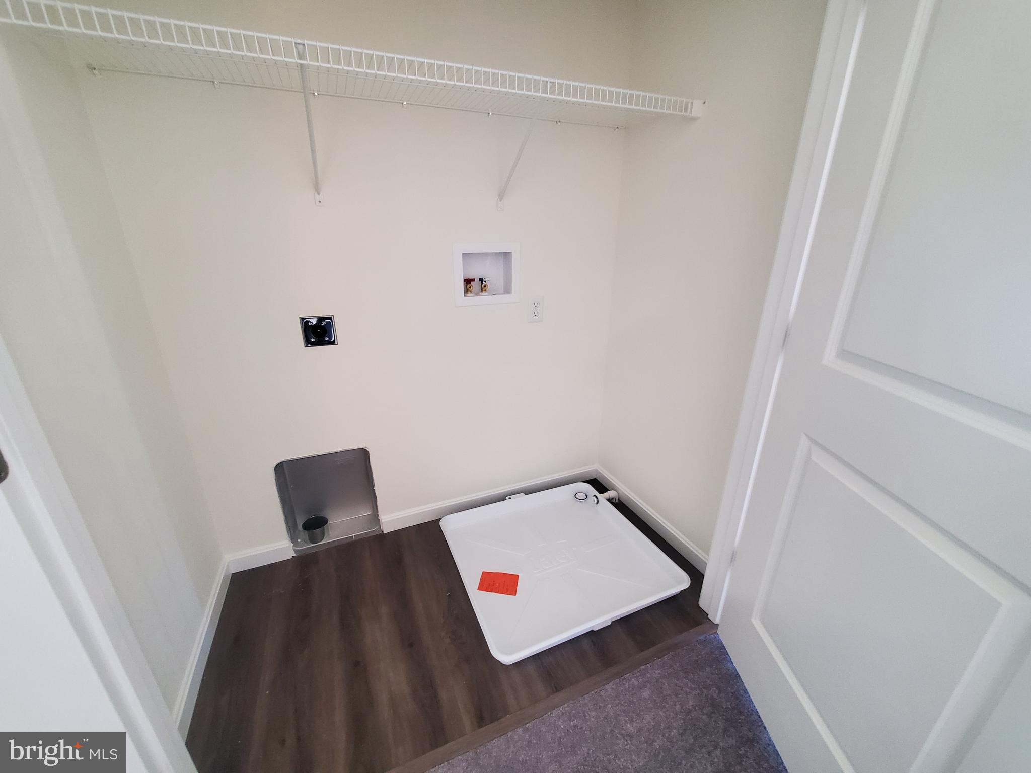 205 Cilento Drive Magnolia, DE 19962 - Photo 38 of 46 a living room with furniture and a rug