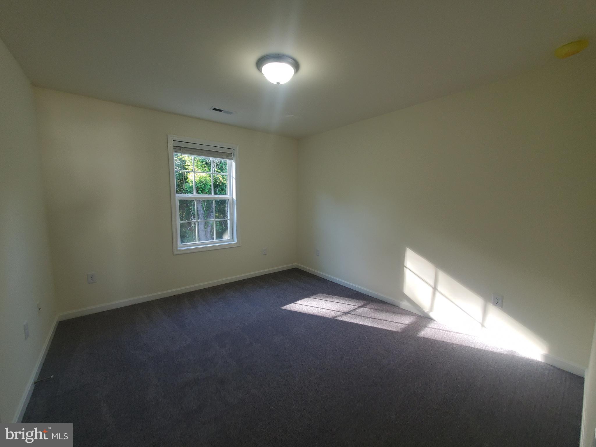 205 Cilento Drive Magnolia, DE 19962 - Photo 41 of 46 an empty room with a window