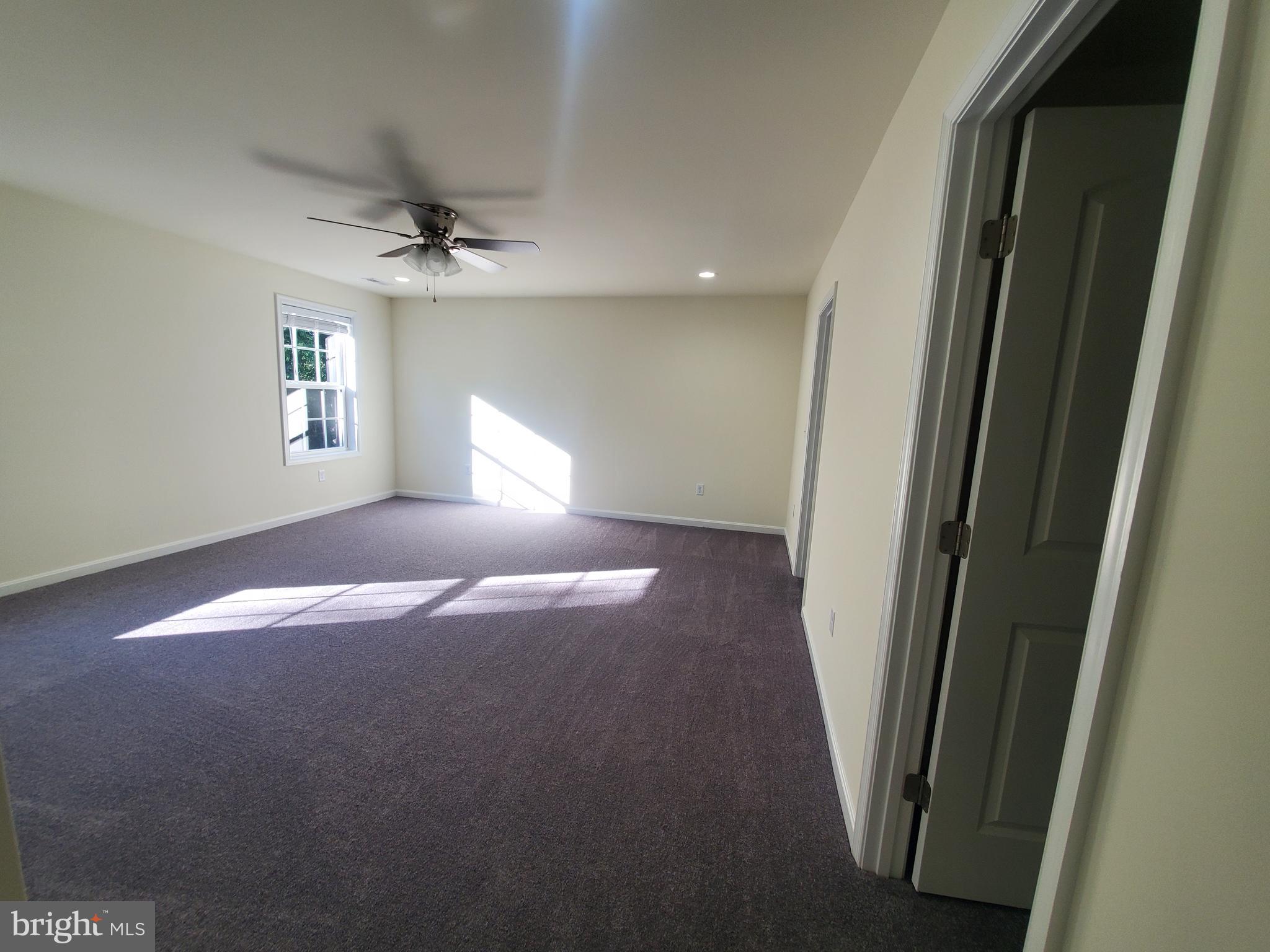 205 Cilento Drive Magnolia, DE 19962 - Photo 10 of 46 a view of empty room with windows