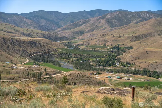 a view of a town with mountains in the background