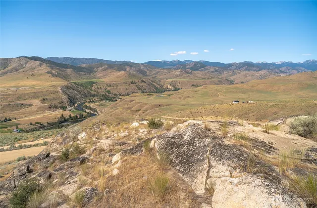 a view of an ocean and a mountain