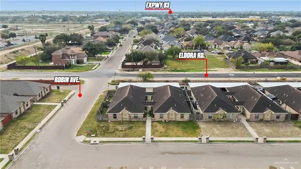 an aerial view of a house with a ocean view