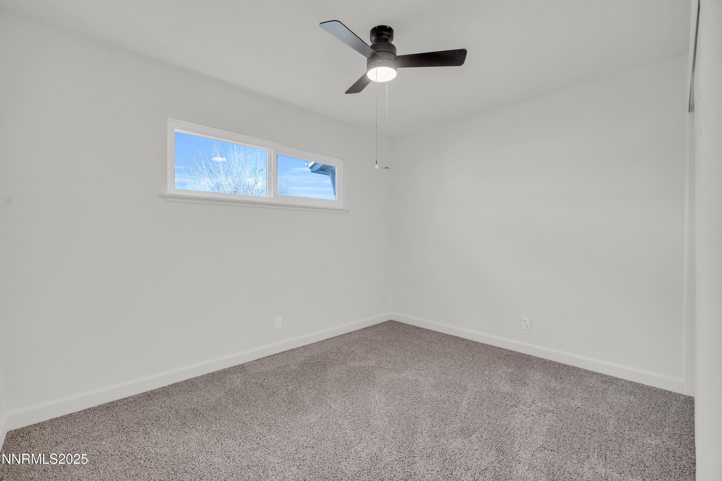 705 York Way Sparks, NV 89431 - Photo 12 of 17 an empty room with a window