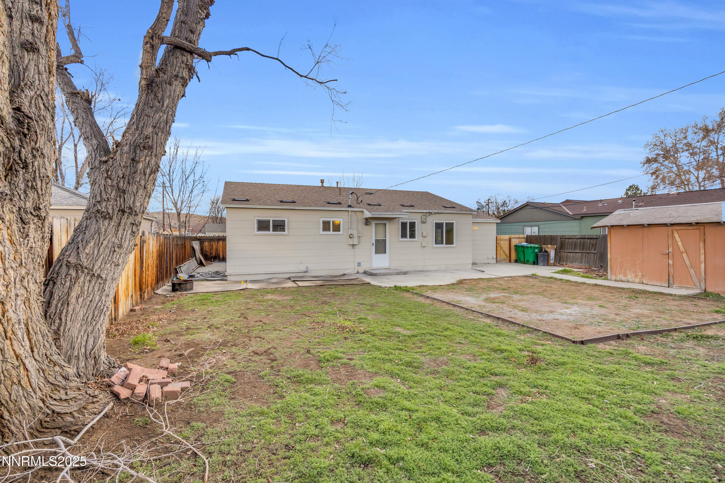 705 York Way Sparks, NV 89431 - Photo 16 of 17 a view of a house with a backyard