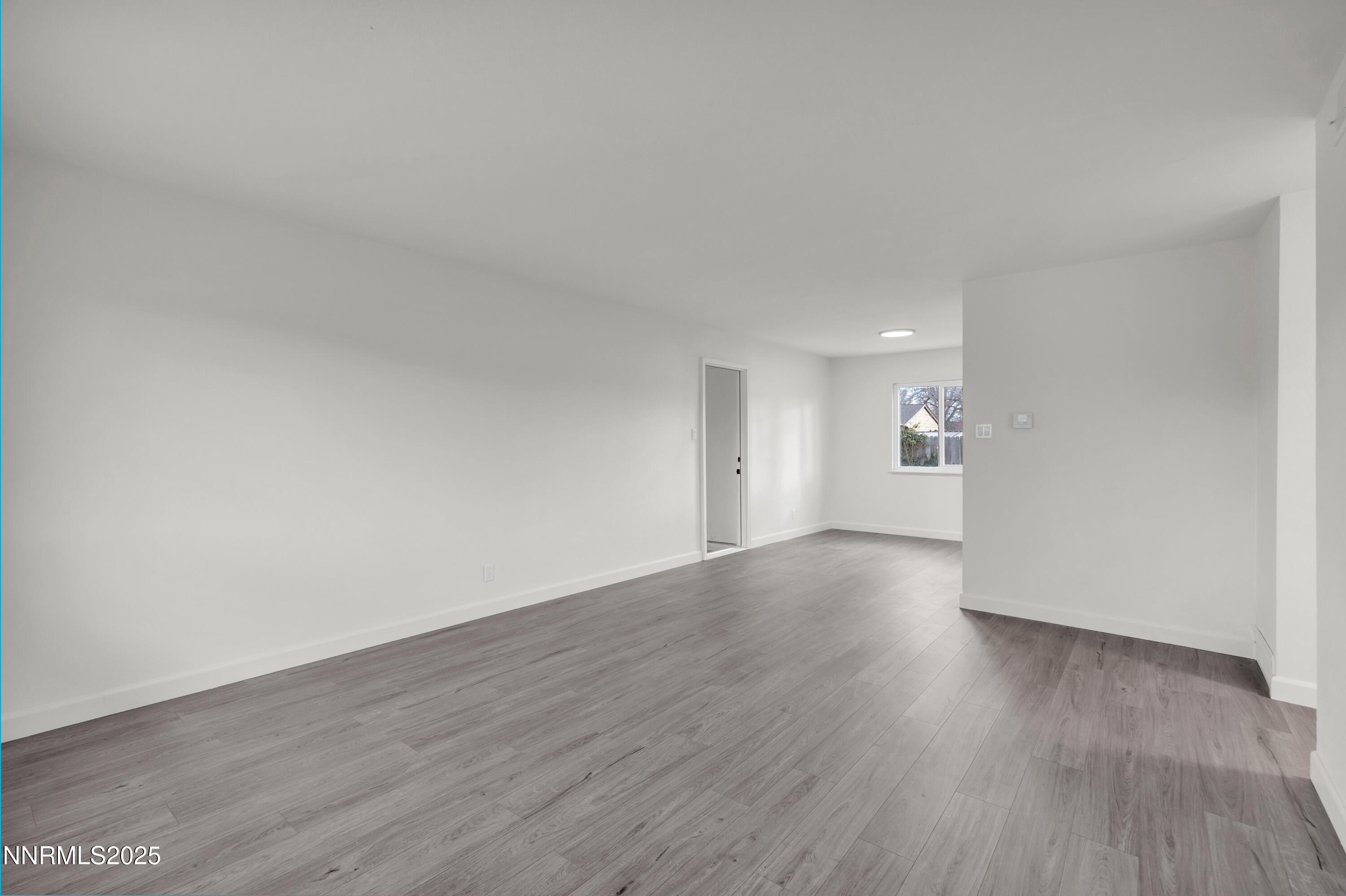 705 York Way Sparks, NV 89431 - Photo 9 of 17 a view of an empty room and wooden floor