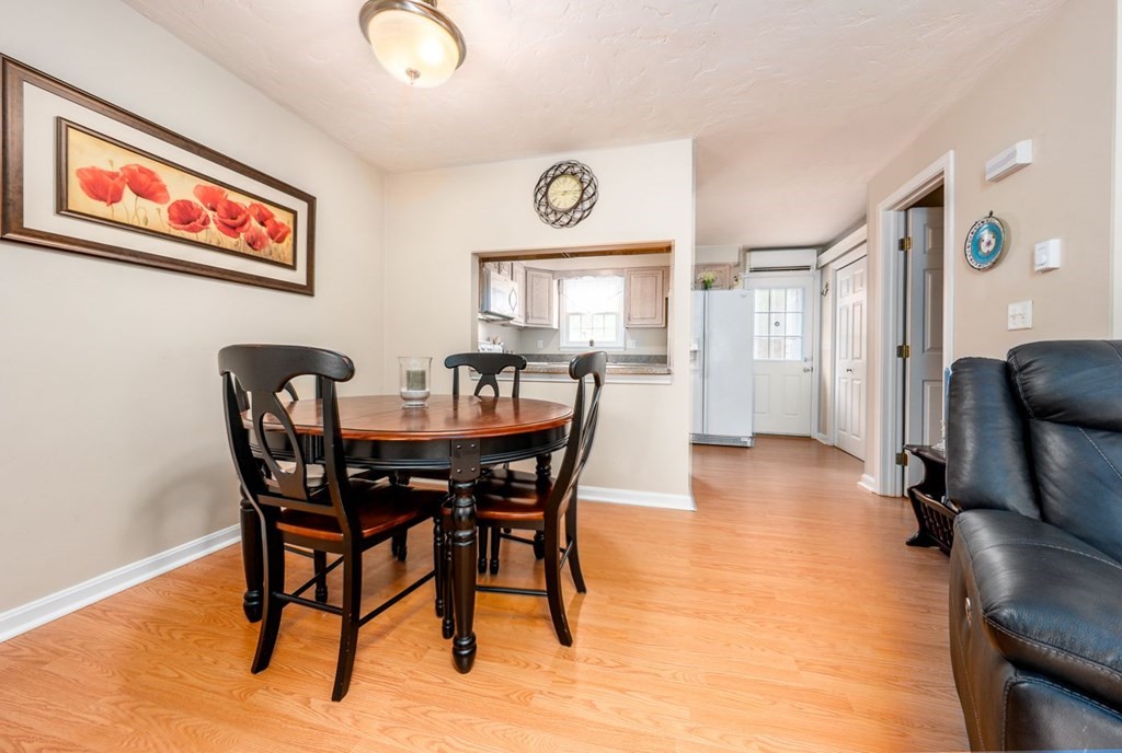 36 Atkins Road, Unit E2 Sandwich, MA 02537 - Photo 11 of 21 a view of a dining room with furniture and a chandelier