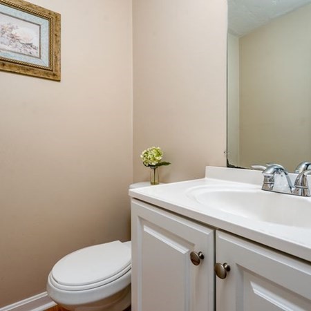 36 Atkins Road, Unit E2 Sandwich, MA 02537 - Photo 13 of 21 a bathroom with a sink mirror vanity and toilet