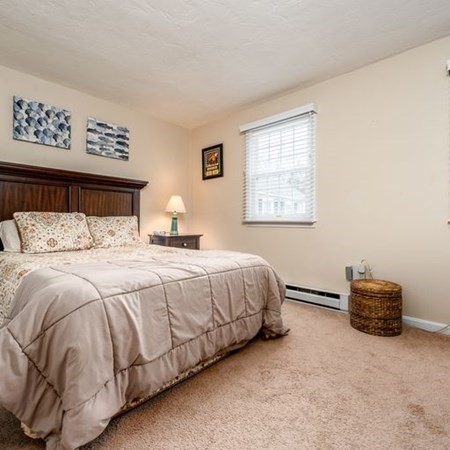 36 Atkins Road, Unit E2 Sandwich, MA 02537 - Photo 16 of 21 a bedroom with a bed and a window