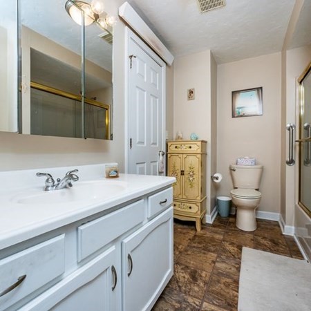 36 Atkins Road, Unit E2 Sandwich, MA 02537 - Photo 18 of 21 a spacious bathroom with a granite countertop sink and a toilet