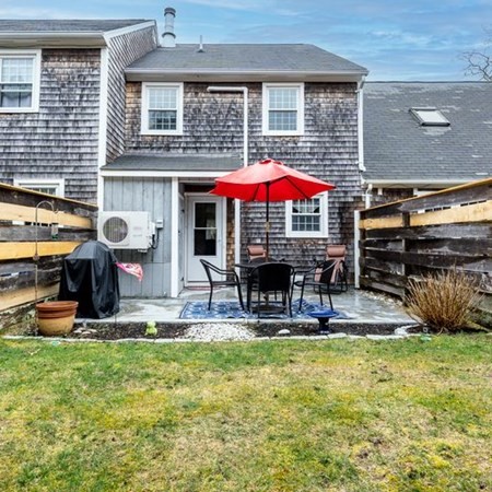 36 Atkins Road, Unit E2 Sandwich, MA 02537 - Photo 20 of 21 a view of a house with backyard porch and sitting area