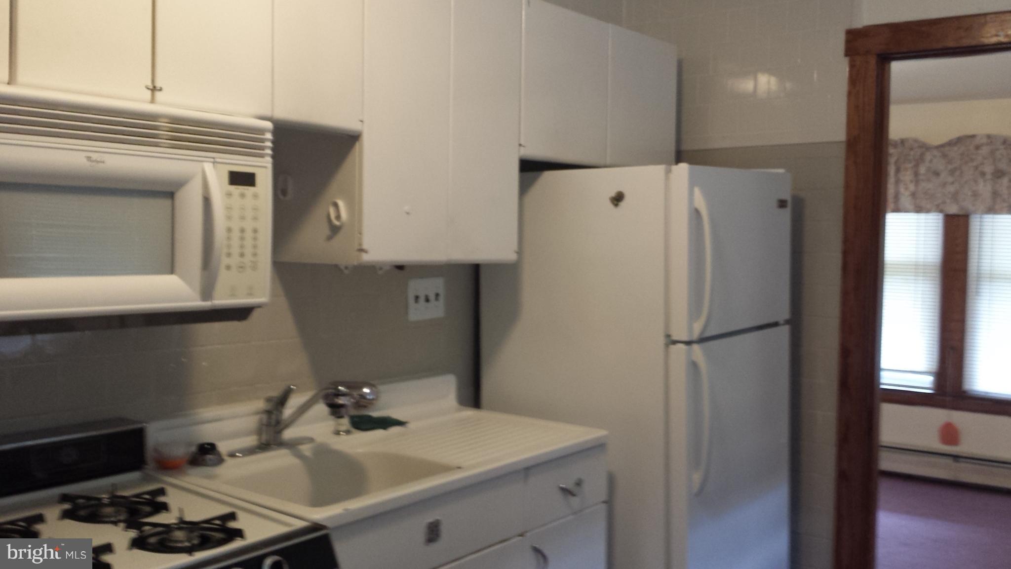 623 Edgewood Road Edgewood, MD 21040 - Photo 3 of 19 a white refrigerator freezer sitting inside of a kitchen