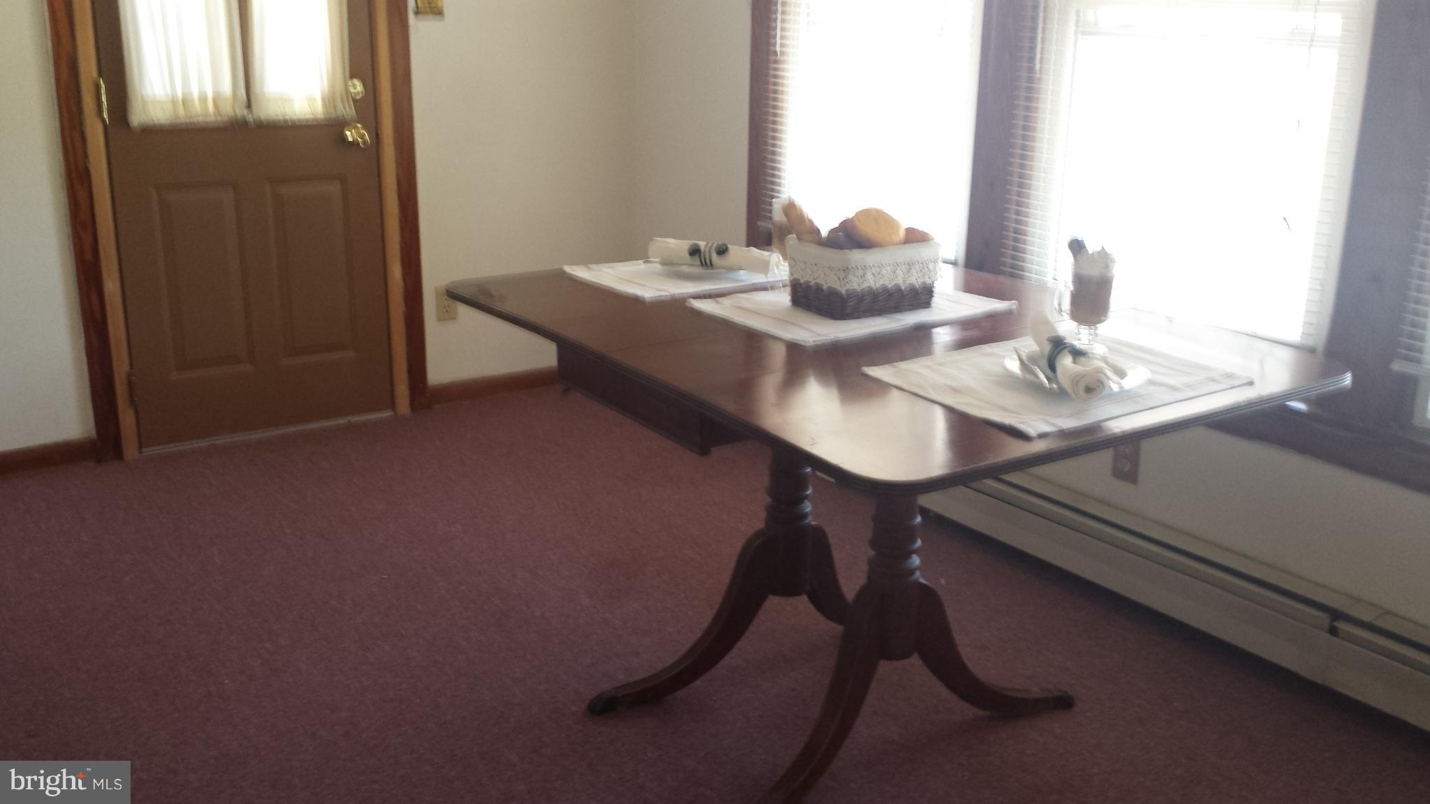 623 Edgewood Road Edgewood, MD 21040 - Photo 6 of 19 a dining room with furniture and wooden floor