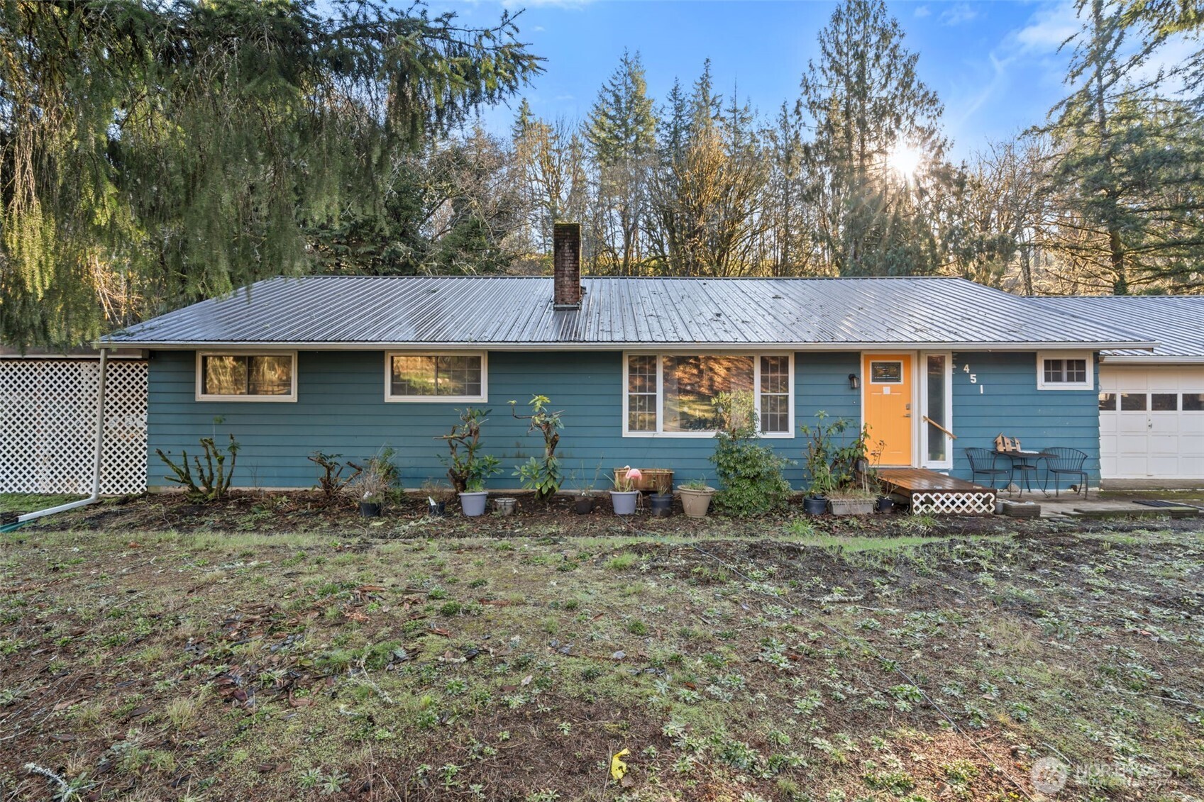 451 Elk Creek Road Chehalis, WA 98532 - Photo 3 of 31 a front view of a house with a garden