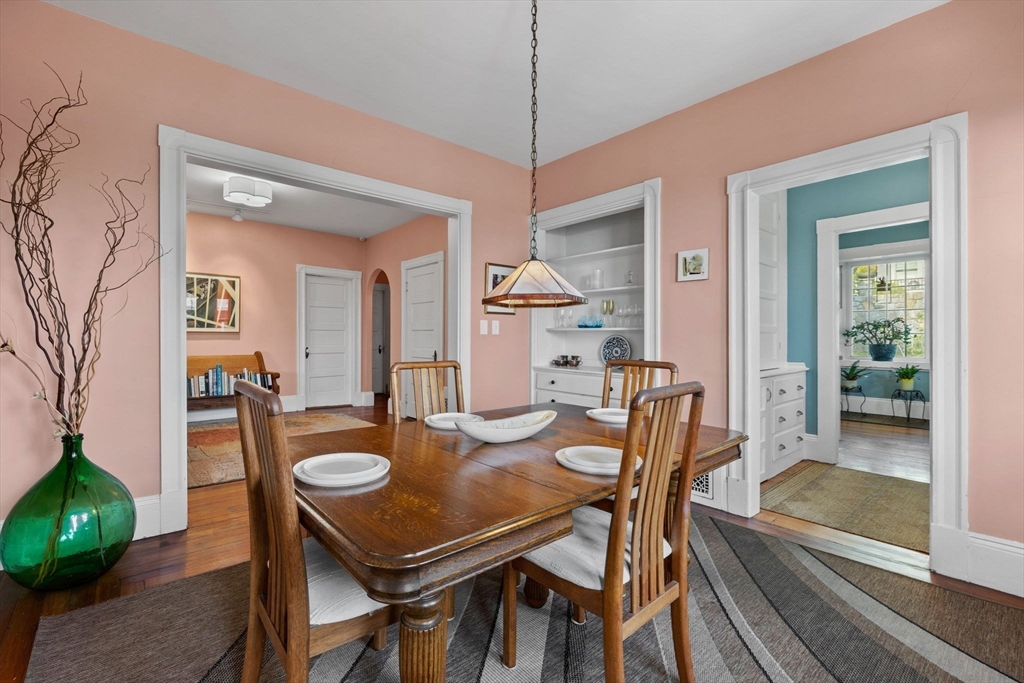 13 Cedar Hill Terrace, Unit 2 Swampscott, MA 01907 - Photo 13 of 34 a dining room with furniture and a floor to ceiling window