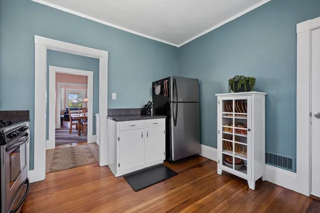 a view of kitchen and wooden floor