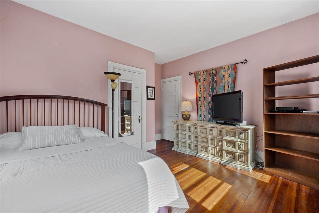 13 Cedar Hill Terrace, Unit 2 Swampscott, MA 01907 - Photo 20 of 34 a bedroom with a bed and a flat screen tv