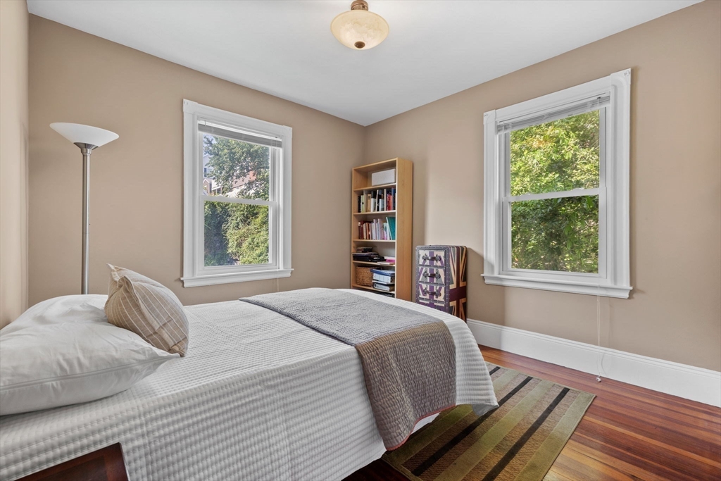 13 Cedar Hill Terrace, Unit 2 Swampscott, MA 01907 - Photo 23 of 34 a bedroom with a bed and a window