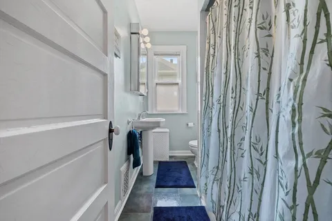 a bathroom with a sink and a shower