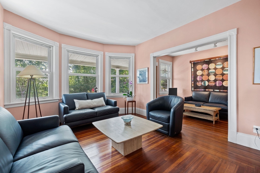 13 Cedar Hill Terrace, Unit 2 Swampscott, MA 01907 - Photo 10 of 34 a living room with furniture and a large window