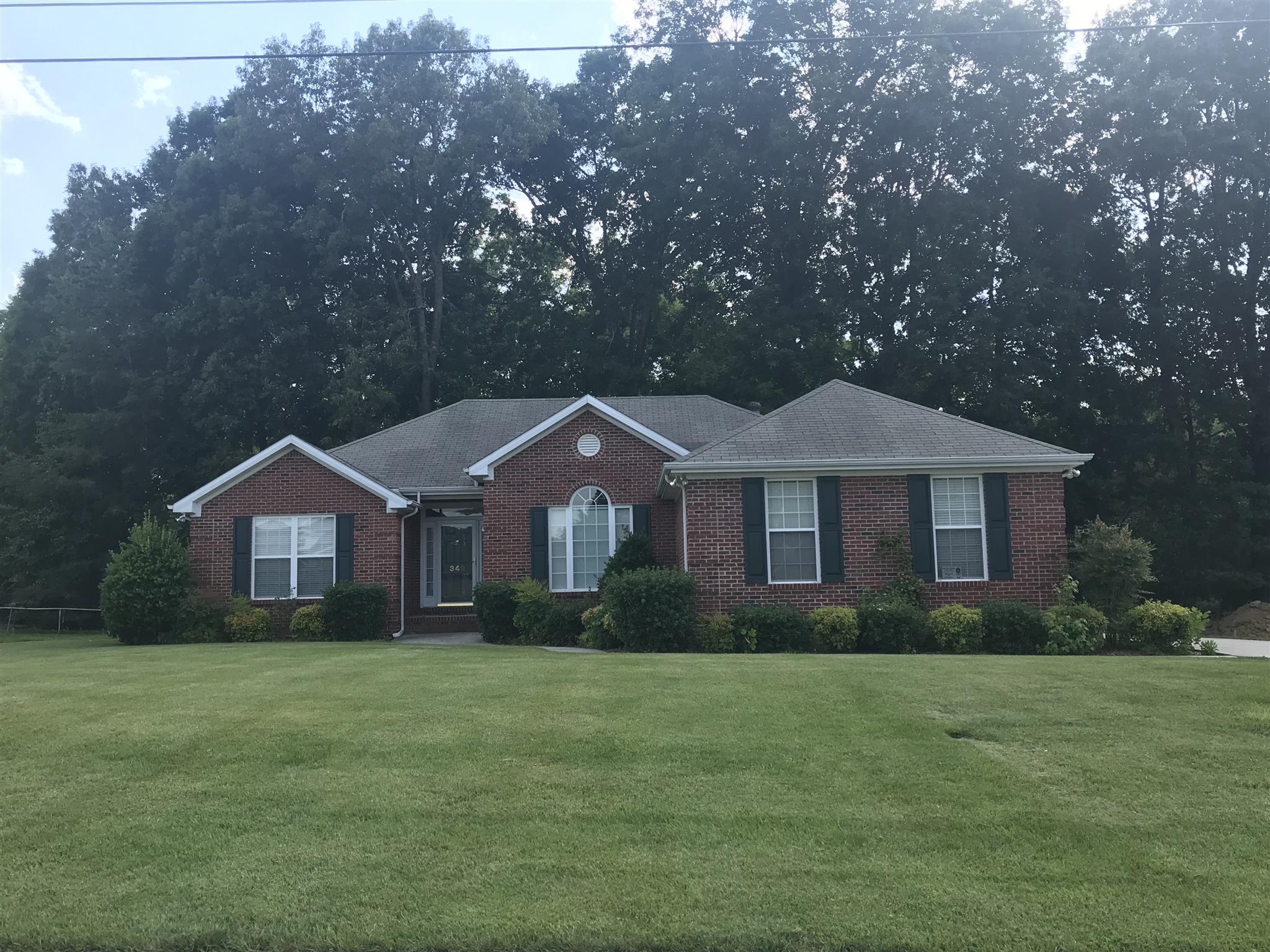 349 Duck River Road Manchester, TN 37355 - Photo 1 of 18 a front view of a house with a garden
