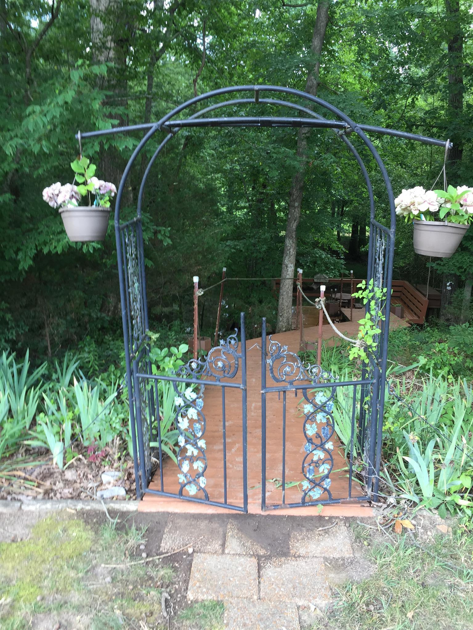 349 Duck River Road Manchester, TN 37355 - Photo 14 of 18 a view of a chair and table in the garden